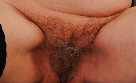 Sultry grandma Norma revealing big titties and spreading her legs 